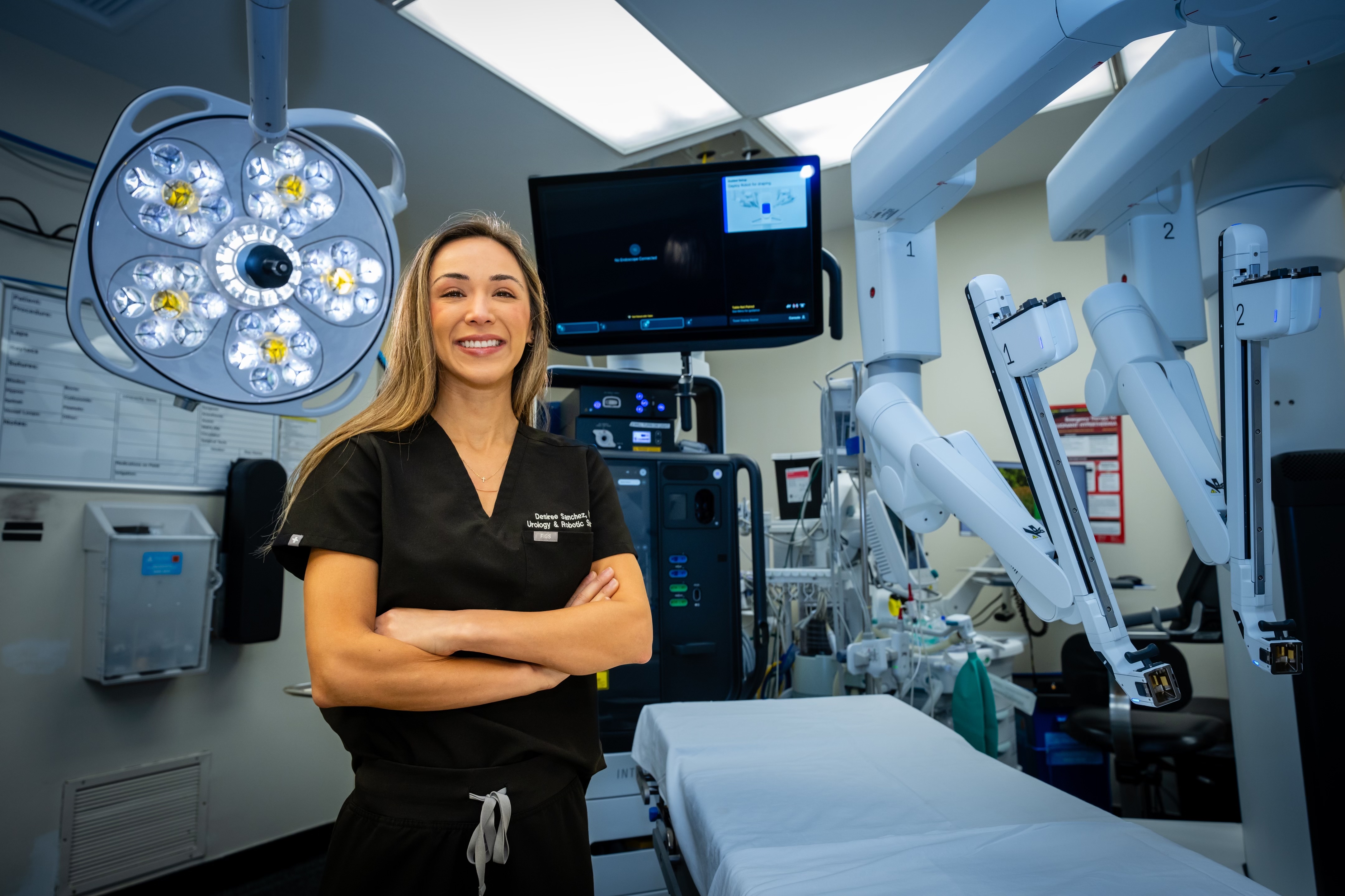 Dr. Desiree Sanchez at robotic surgery console